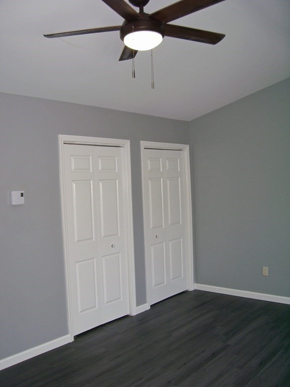4 Balcomb Street, Unit 4 Salem, MA 01970 - Photo 22 of 38 a view of an empty room with wooden floor