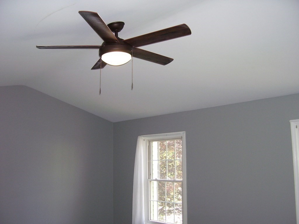4 Balcomb Street, Unit 4 Salem, MA 01970 - Photo 27 of 38 a view of an empty room with a ceiling fan and window
