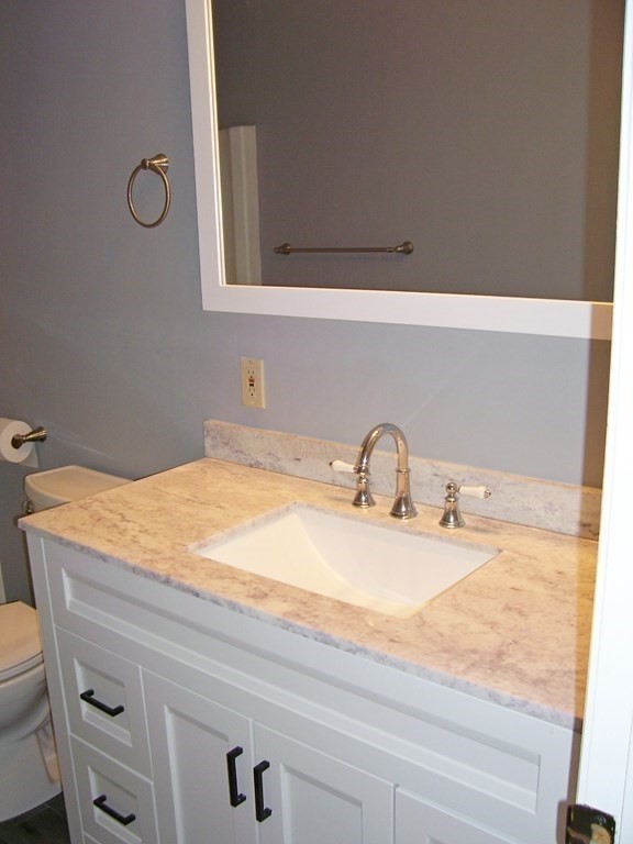 4 Balcomb Street, Unit 4 Salem, MA 01970 - Photo 28 of 38 a bathroom with a sink and a mirror