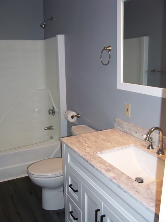 4 Balcomb Street, Unit 4 Salem, MA 01970 - Photo 29 of 38 a bathroom with a sink a toilet and shower