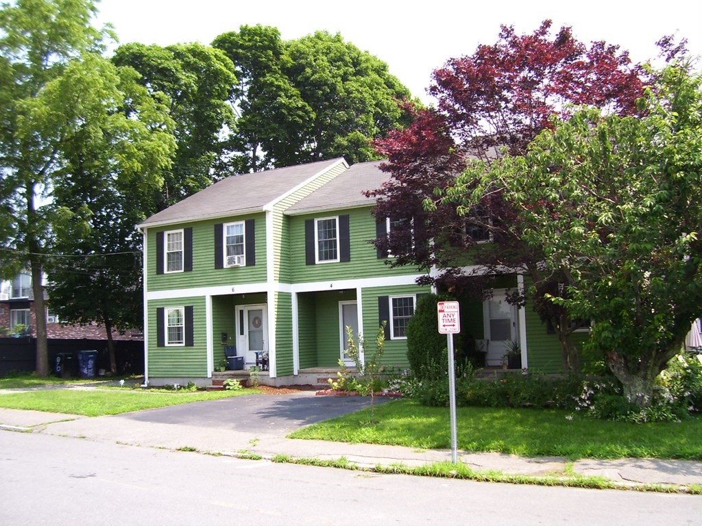 4 Balcomb Street, Unit 4 Salem, MA 01970 - Photo 3 of 38 front view of a house with a yard