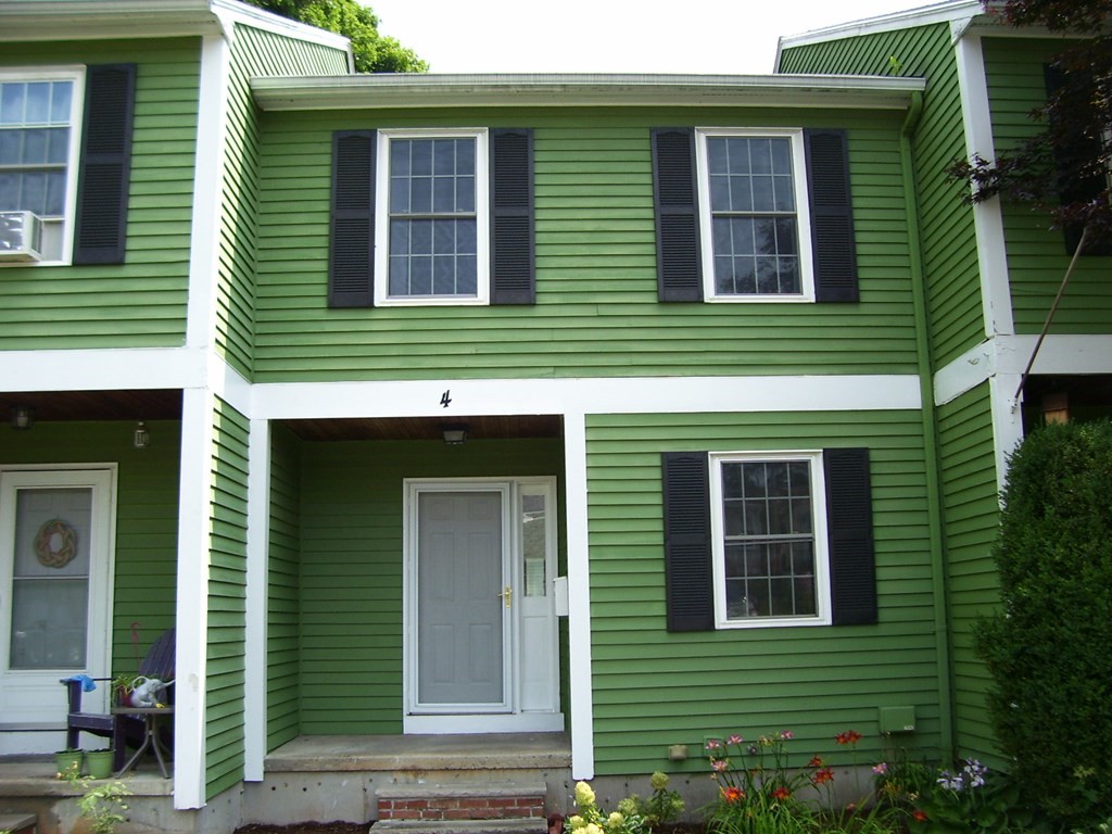 4 Balcomb Street, Unit 4 Salem, MA 01970 - Photo 4 of 38 a front view of a house with plants