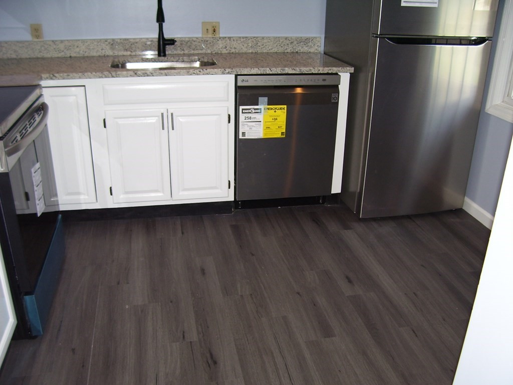 4 Balcomb Street, Unit 4 Salem, MA 01970 - Photo 10 of 38 a view of an empty room with wooden floor and a window