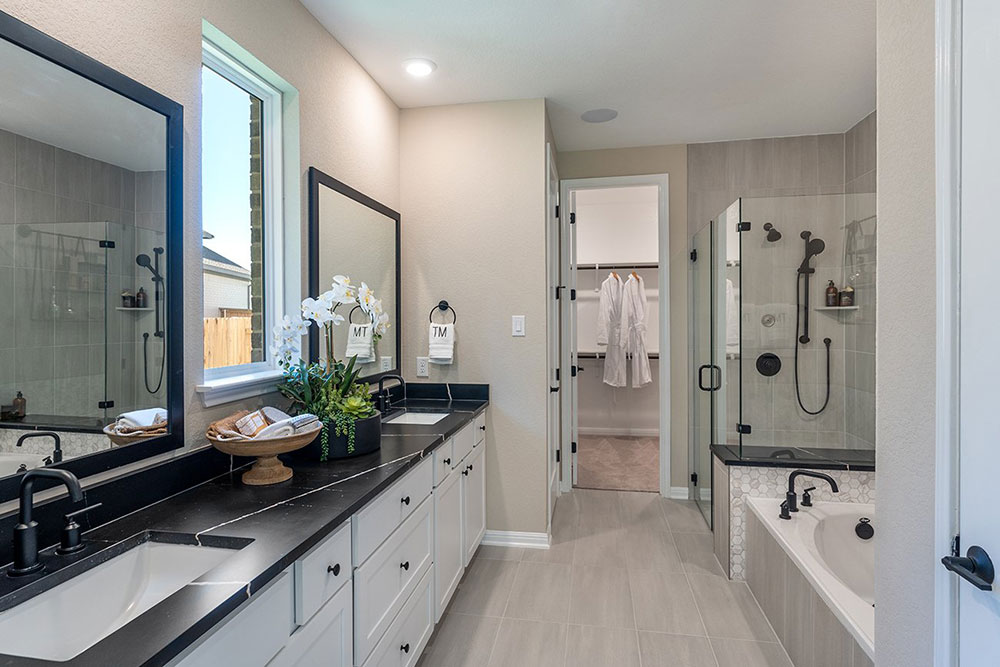 1212 Scenic Grn Loop Georgetown, TX 78628 - Photo 17 of 36 a spacious bathroom with a granite countertop tub shower and mirror