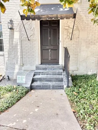 a front view of a house with stairs