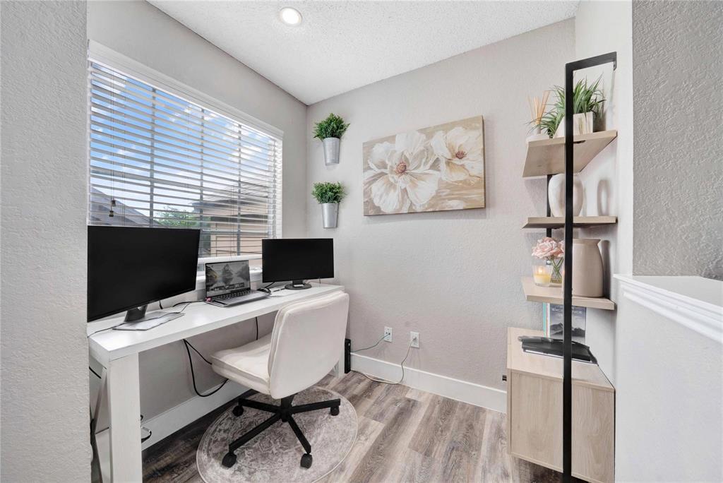 8518 Coppertowne Lane Dallas, TX 75243 - Photo 16 of 32 a view of a workspace with furniture and a window