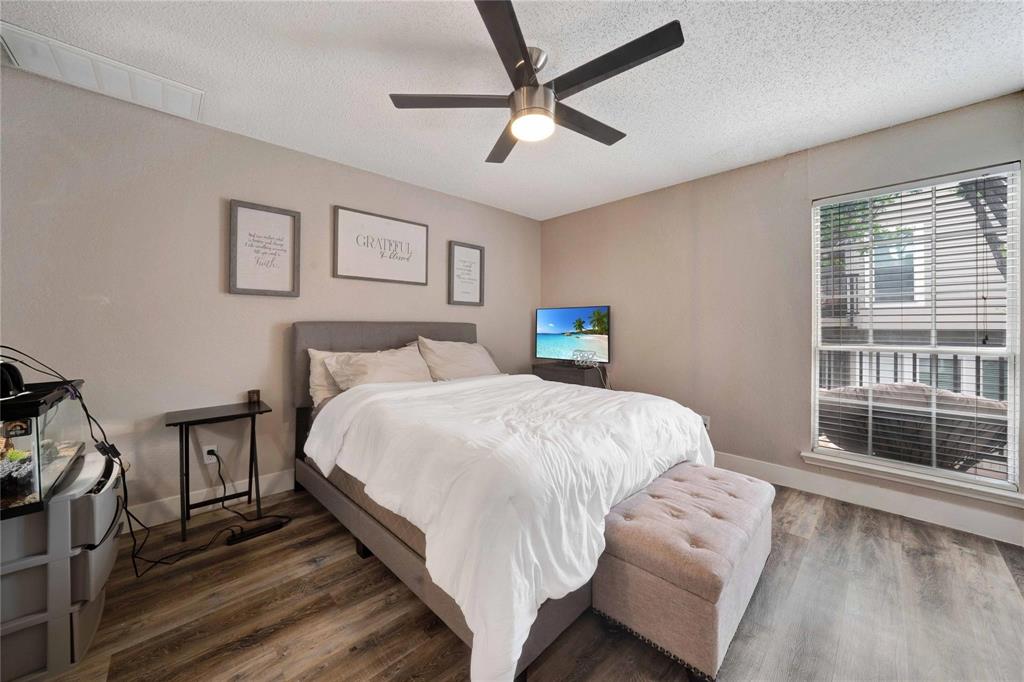 8518 Coppertowne Lane Dallas, TX 75243 - Photo 17 of 32 a bedroom with a bed and a window