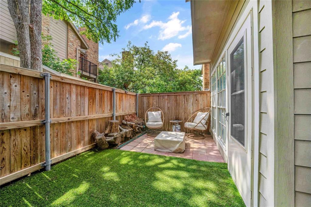 8518 Coppertowne Lane Dallas, TX 75243 - Photo 26 of 32 a view of backyard with barbeque grill and wooden fence