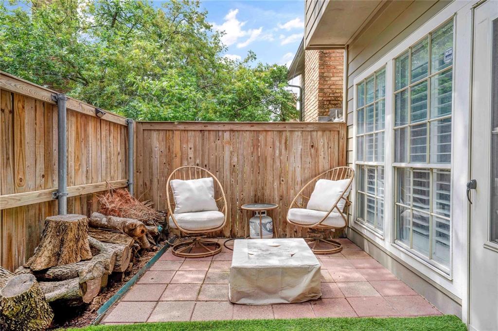 8518 Coppertowne Lane Dallas, TX 75243 - Photo 27 of 32 a view of a chairs and table in backyard of the house