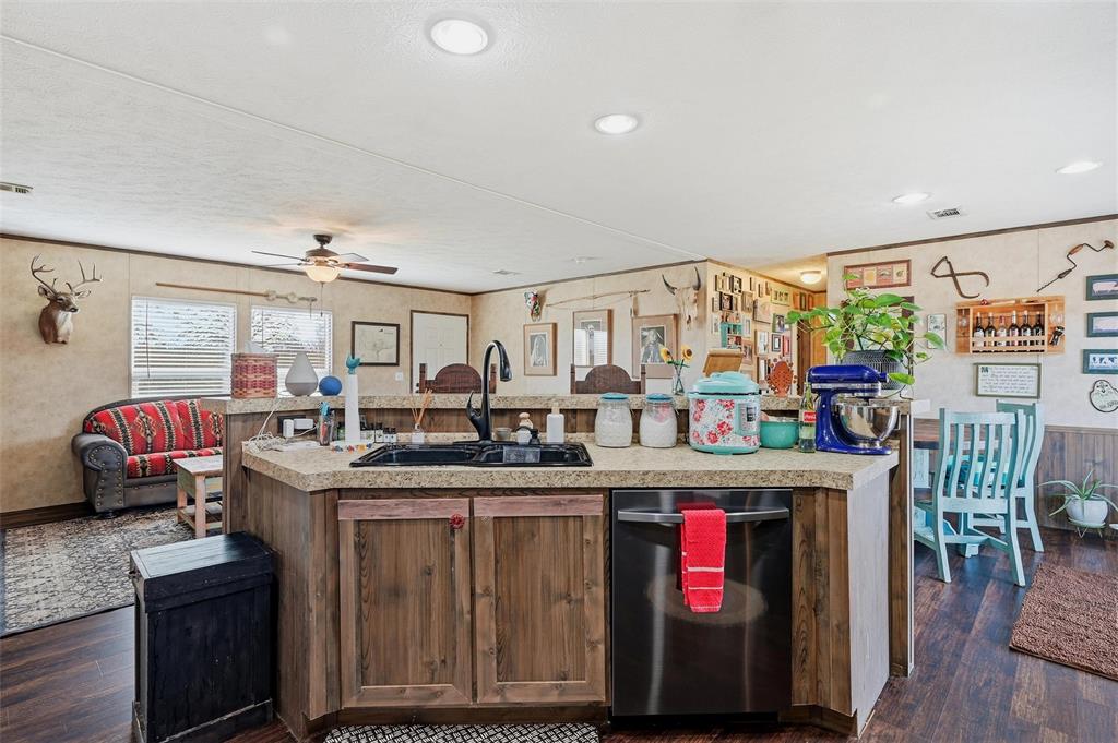 1949 Greer Road Sadler, TX 76264 - Photo 11 of 39 a kitchen with stainless steel appliances granite countertop a stove and cabinets