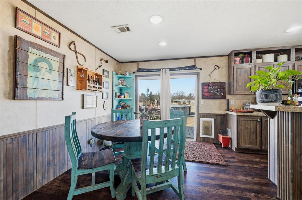 1949 Greer Road Sadler, TX 76264 - Photo 13 of 39 a view of a dining room with furniture window and wooden floor