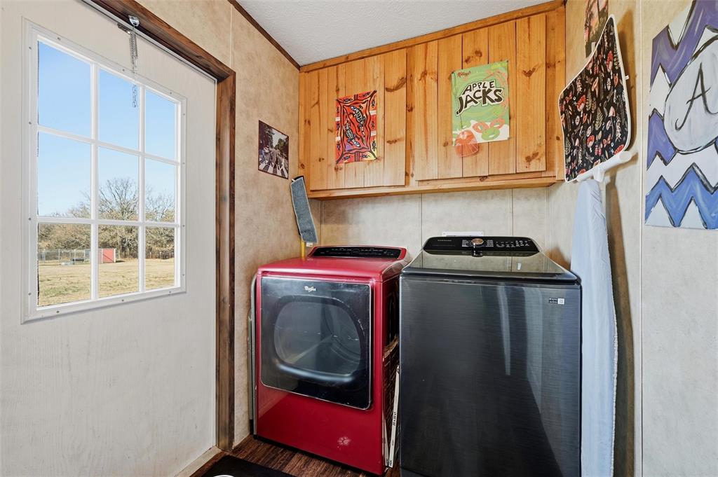 1949 Greer Road Sadler, TX 76264 - Photo 14 of 39 a utility room with dryer and washer