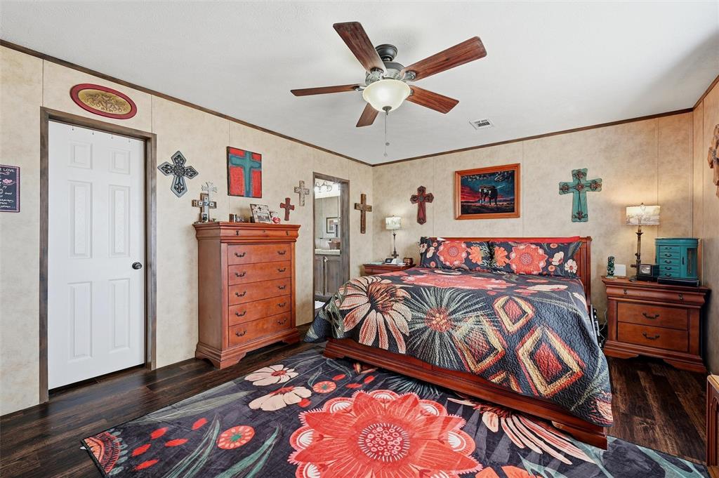 1949 Greer Road Sadler, TX 76264 - Photo 17 of 39 a bedroom with a bed and a dresser