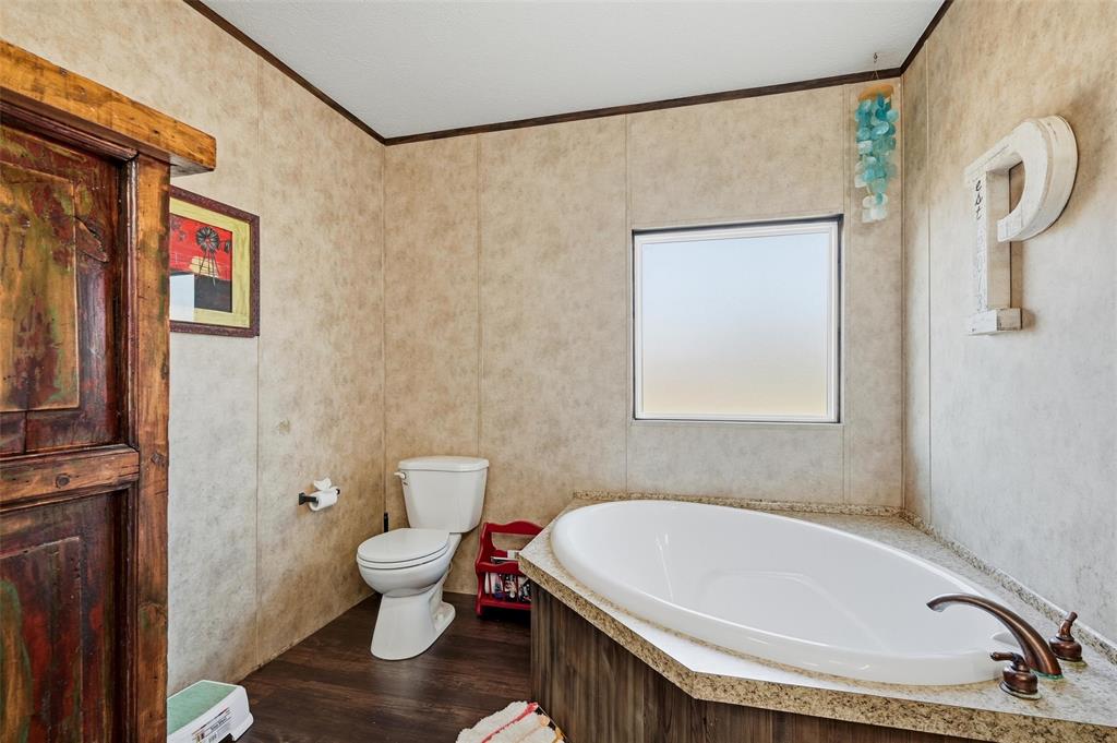 1949 Greer Road Sadler, TX 76264 - Photo 20 of 39 a bathroom with a sink and a toilet