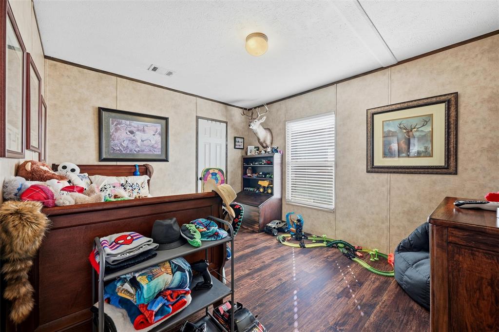 1949 Greer Road Sadler, TX 76264 - Photo 21 of 39 a bed room with furniture and a window