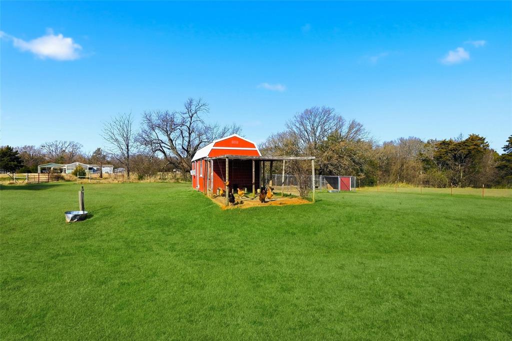 1949 Greer Road Sadler, TX 76264 - Photo 25 of 39 a view of a house with a yard