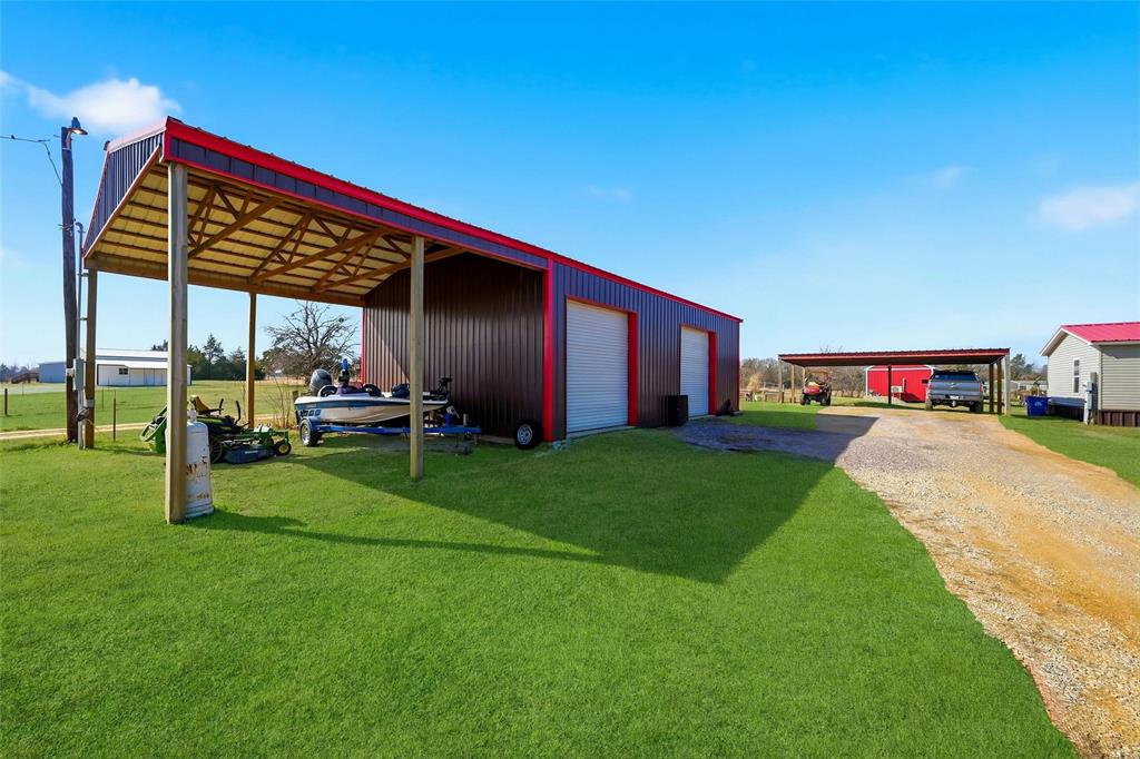 1949 Greer Road Sadler, TX 76264 - Photo 29 of 39 a view of an house with backyard space and porch