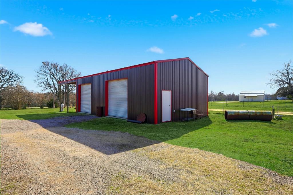 1949 Greer Road Sadler, TX 76264 - Photo 33 of 39 a view of a house with backyard and a tree