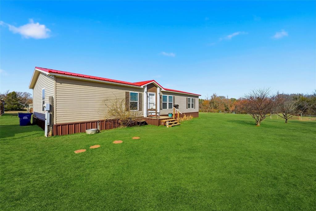 1949 Greer Road Sadler, TX 76264 - Photo 4 of 39 a house view with a garden space