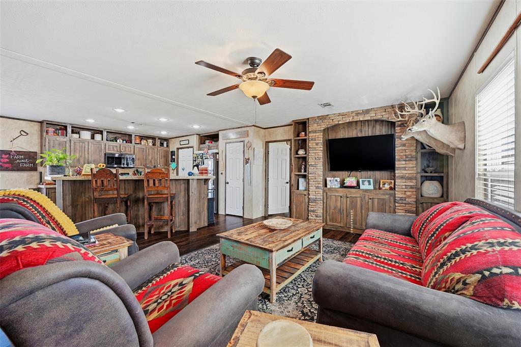 1949 Greer Road Sadler, TX 76264 - Photo 7 of 39 a living room with furniture and a flat screen tv