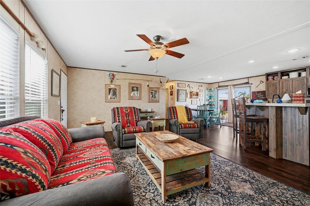 1949 Greer Road Sadler, TX 76264 - Photo 8 of 39 a living room with furniture a ceiling fan and a rug