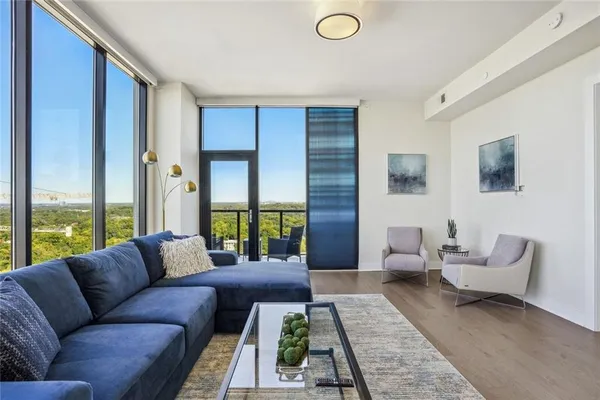 a living room with furniture and a rug