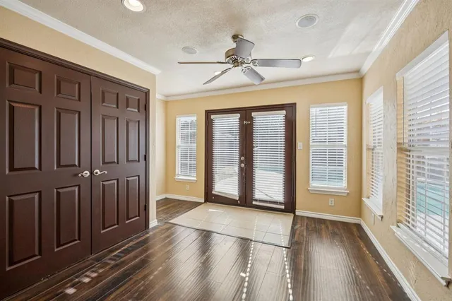 wooden floor in an empty room with a window
