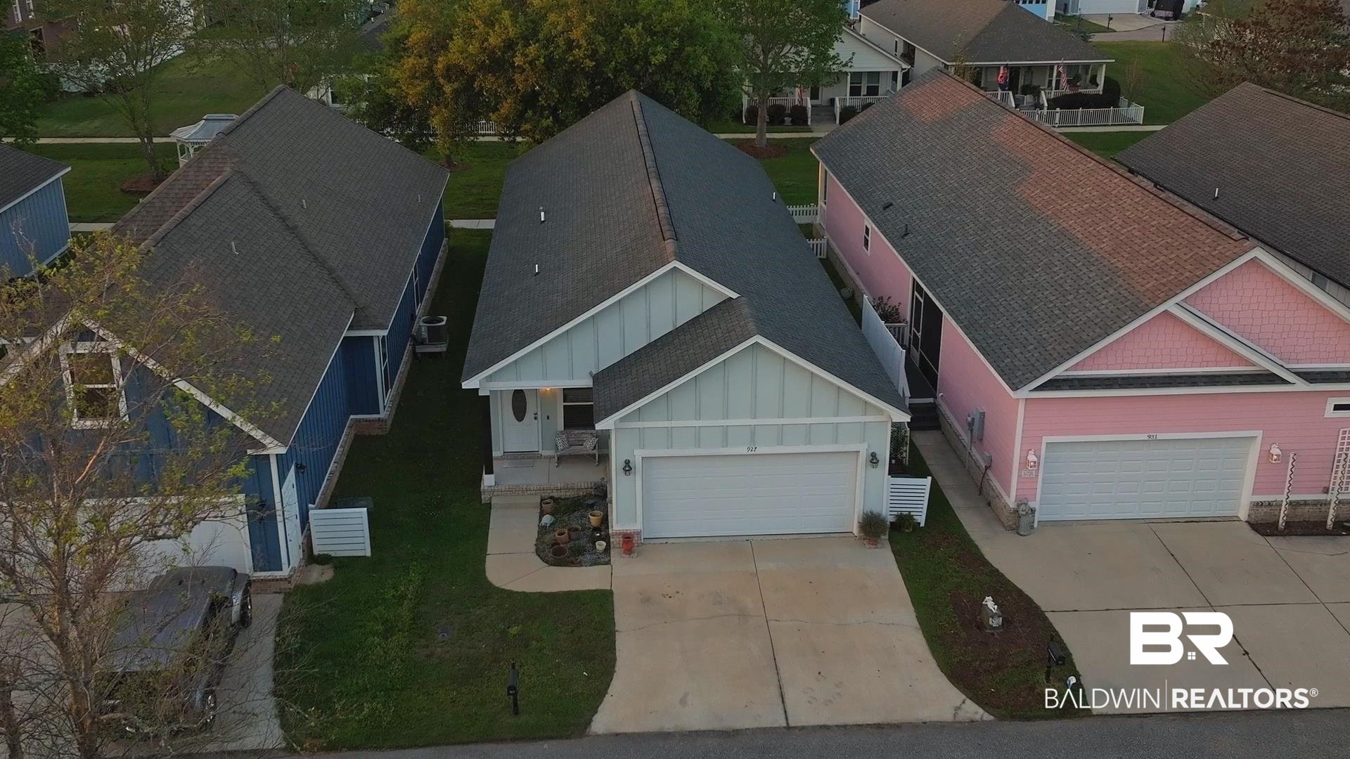 927 Periwinkle Lane Foley, AL 36535 - Photo 17 of 26 Light blue siding exterior with a dark shingle roof