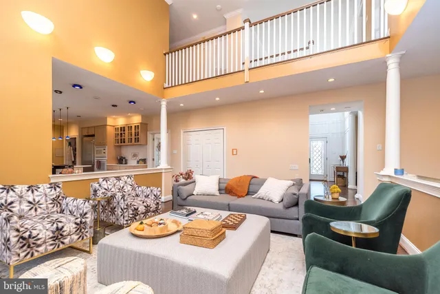 a living room with furniture and a table