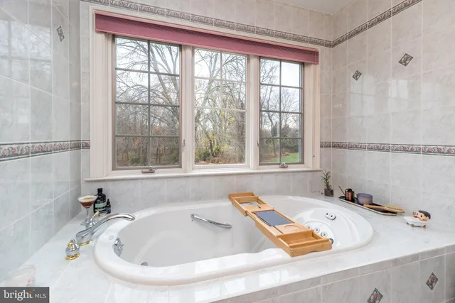 a bath tub sitting next to a window