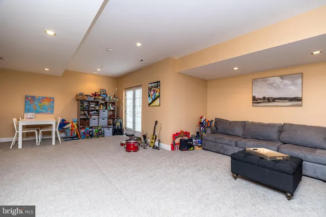a view of a livingroom with furniture and toys