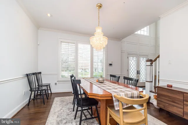 a view of a dining room with furniture and window