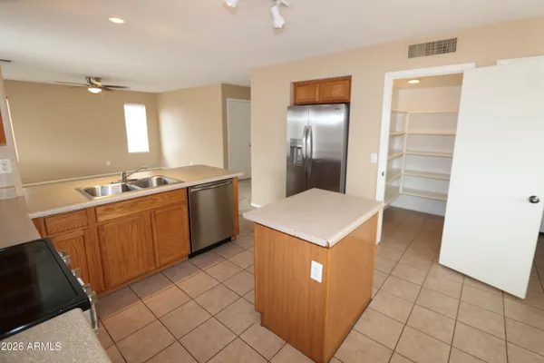 a kitchen with a cabinets and appliances