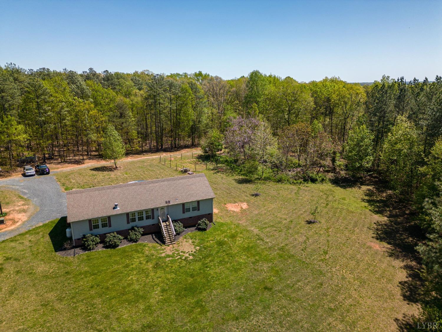 2570 Reedy Spring Road Spout Spring, VA 24593 - Photo 2 of 66 an aerial view of a house with a yard