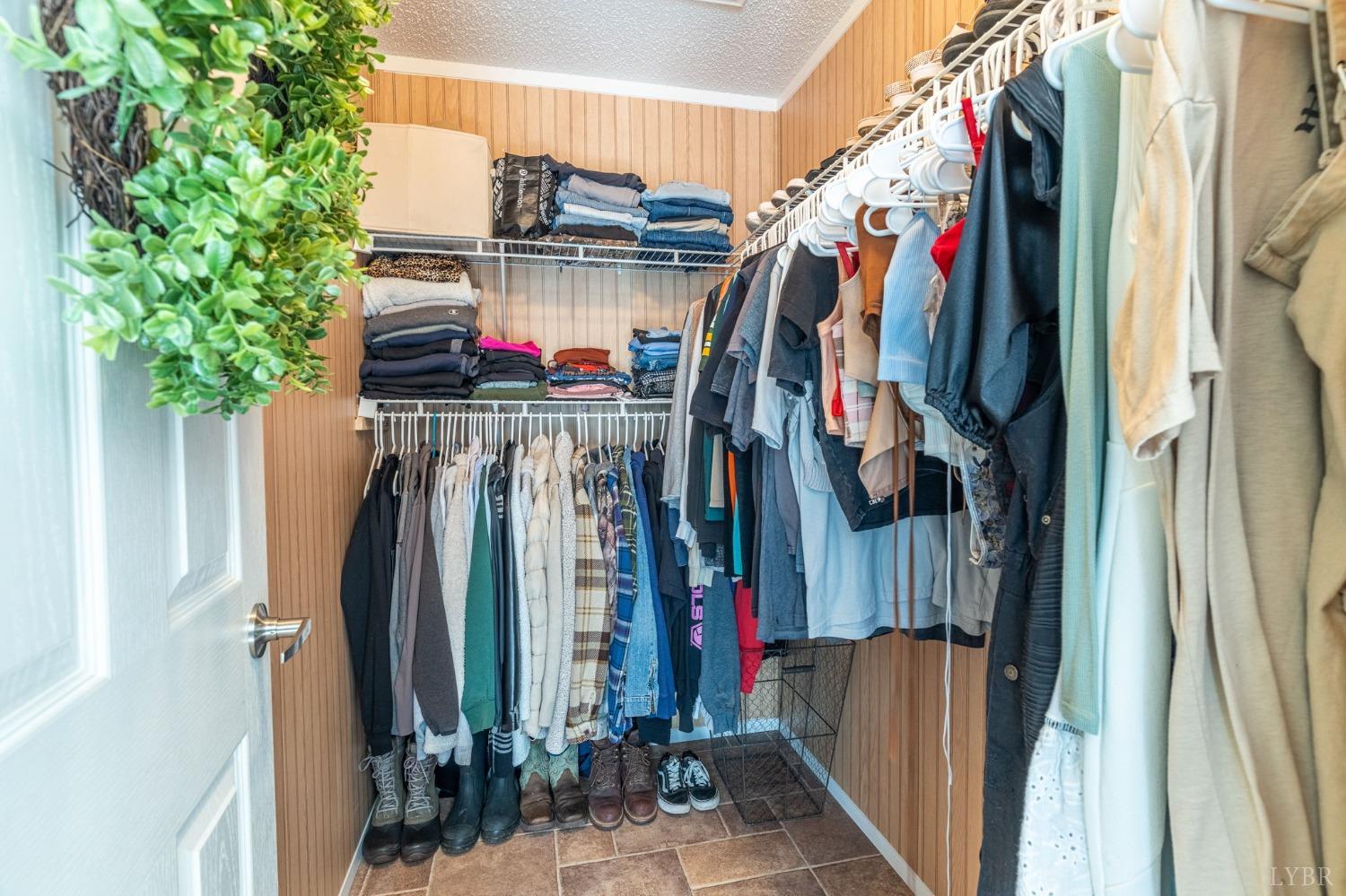 2570 Reedy Spring Road Spout Spring, VA 24593 - Photo 23 of 66 a view of walk in closet with clothes