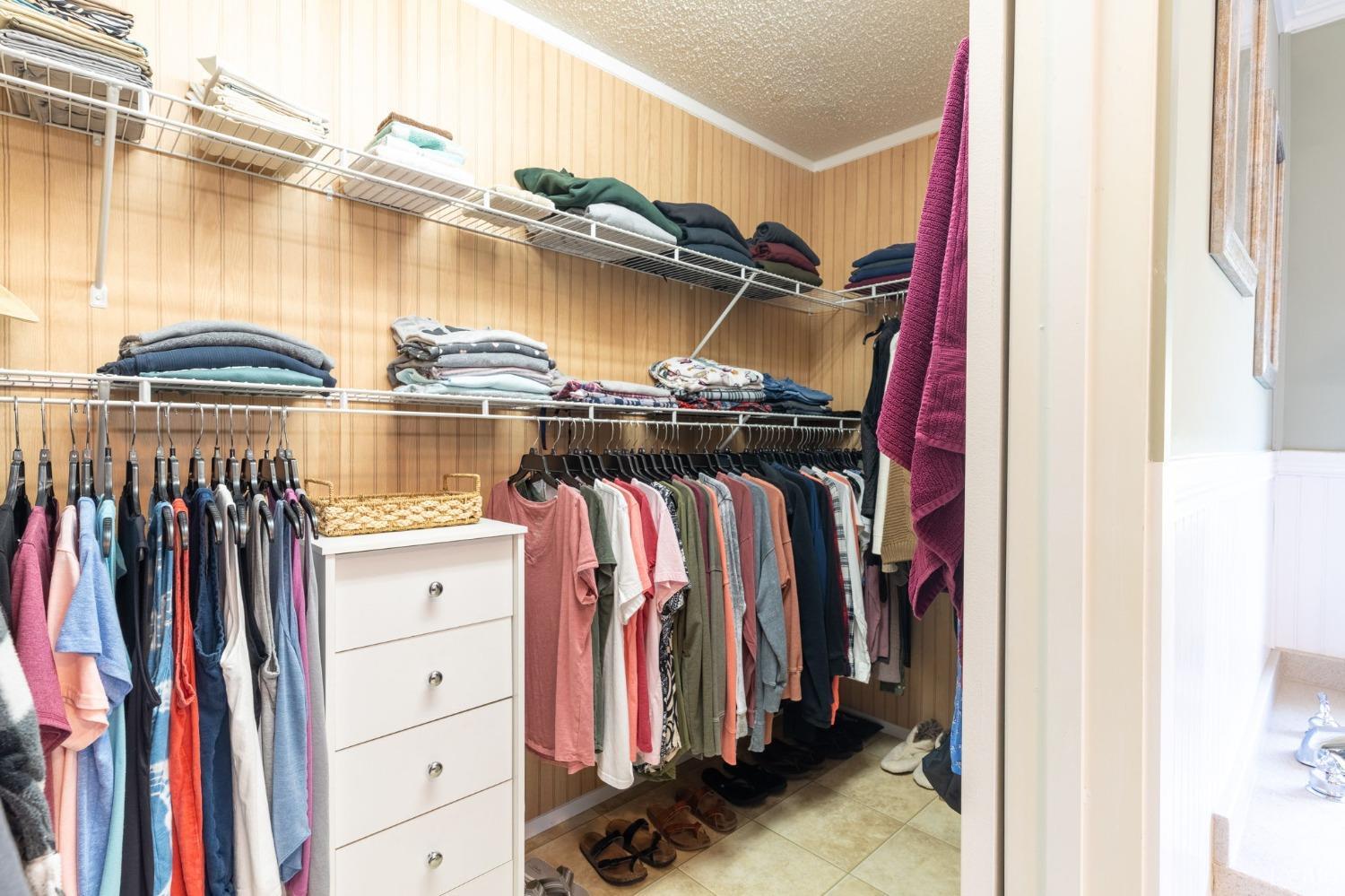 2570 Reedy Spring Road Spout Spring, VA 24593 - Photo 30 of 66 a view of walk in closet with clothes and shoes