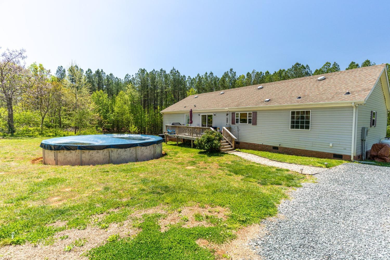 2570 Reedy Spring Road Spout Spring, VA 24593 - Photo 45 of 66 a aerial view of a house with swimming pool and a yard