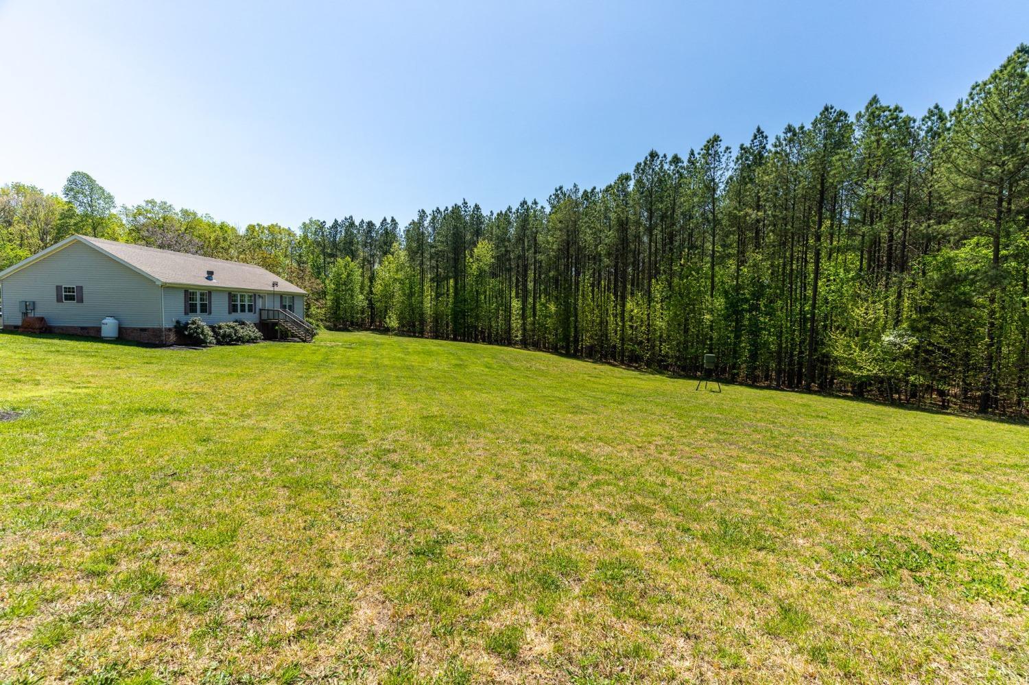 2570 Reedy Spring Road Spout Spring, VA 24593 - Photo 50 of 66 a swimming pool with trees in the background