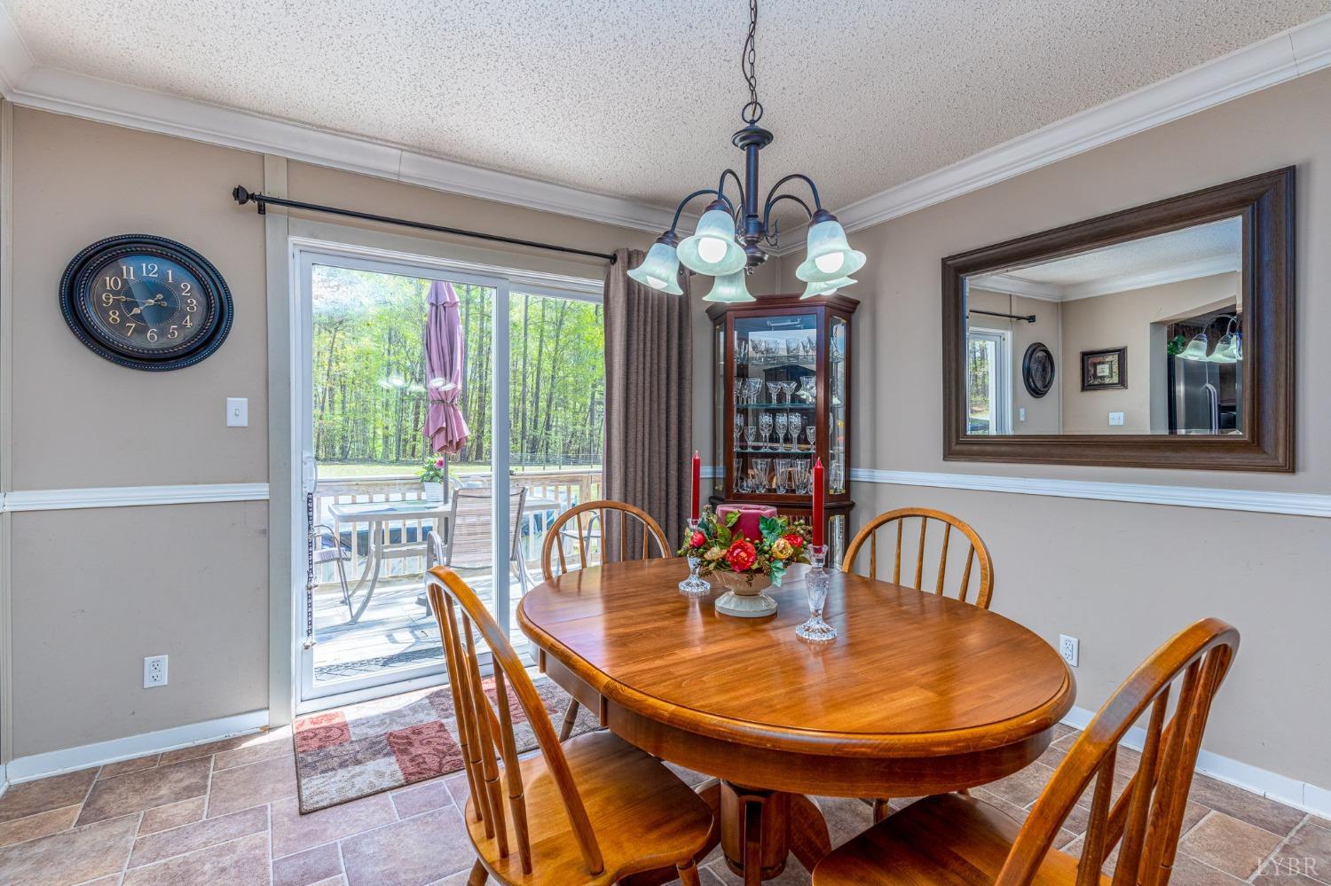 2570 Reedy Spring Road Spout Spring, VA 24593 - Photo 5 of 66 a view of a dining room with furniture window and outside view