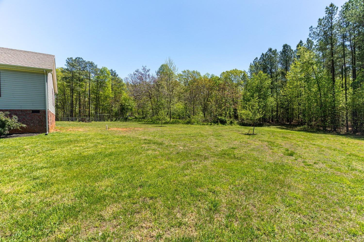 2570 Reedy Spring Road Spout Spring, VA 24593 - Photo 54 of 66 a view of a field with trees in the background