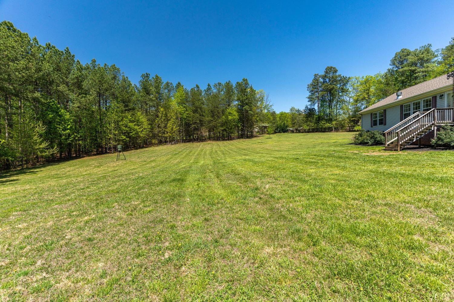 2570 Reedy Spring Road Spout Spring, VA 24593 - Photo 57 of 66 a backyard of a house with lots of green space
