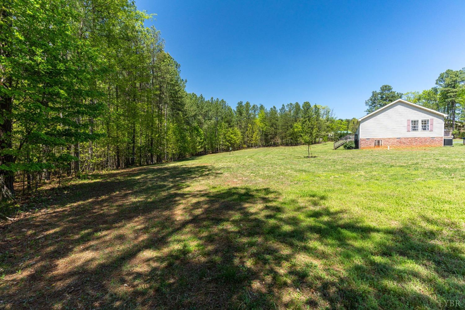 2570 Reedy Spring Road Spout Spring, VA 24593 - Photo 58 of 66 a backyard of a house with lots of green space