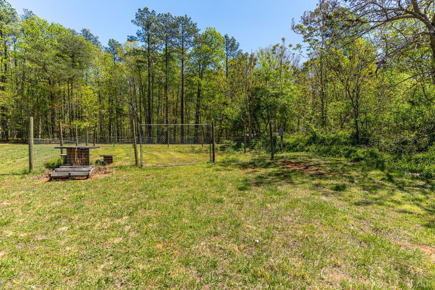 2570 Reedy Spring Road Spout Spring, VA 24593 - Photo 59 of 66 a view of outdoor space with deck and trees