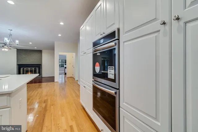a view of a kitchen with furniture a floor to ceiling window and a kitchen counter space