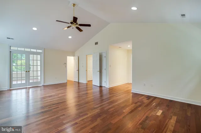 a bathroom with double sink and a mirror