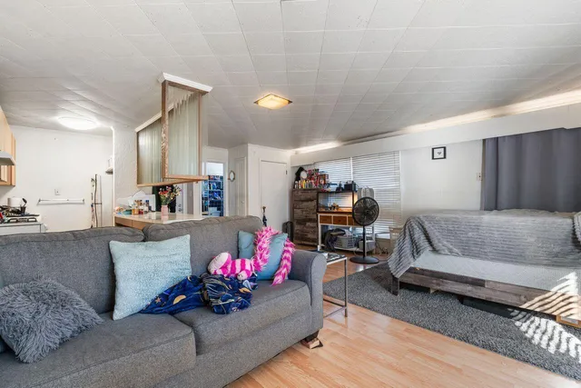 a kitchen with kitchen island a sink stove and refrigerator
