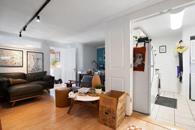 a kitchen with stainless steel appliances granite countertop a sink a stove a refrigerator and cabinets