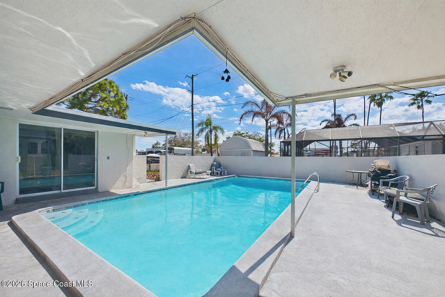 1300 Lester Court Merritt Island, FL 32952 - Photo 15 of 50 a view of a house with a patio