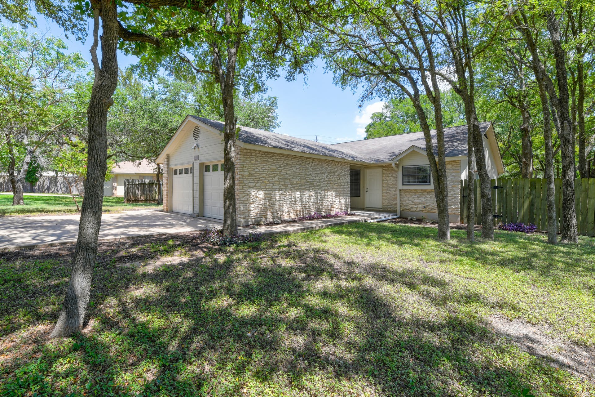 12603 Teague Trail, Unit B Austin, TX 78729 - Photo 1 of 14 a view of a house with backyard and a tree