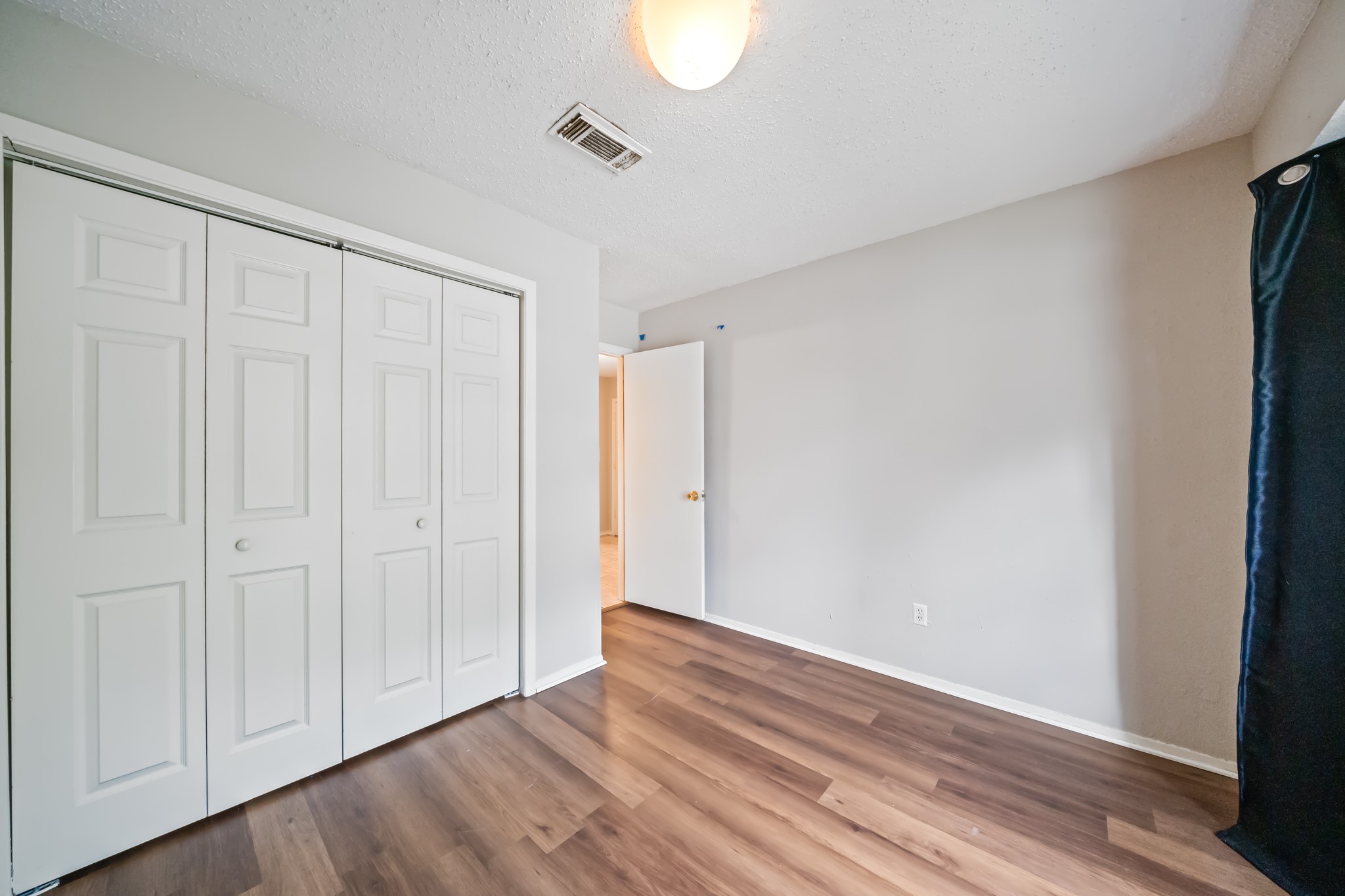 20115 Raingate Lane Katy, TX 77449 - Photo 13 of 25 a view of an empty room with wooden floor